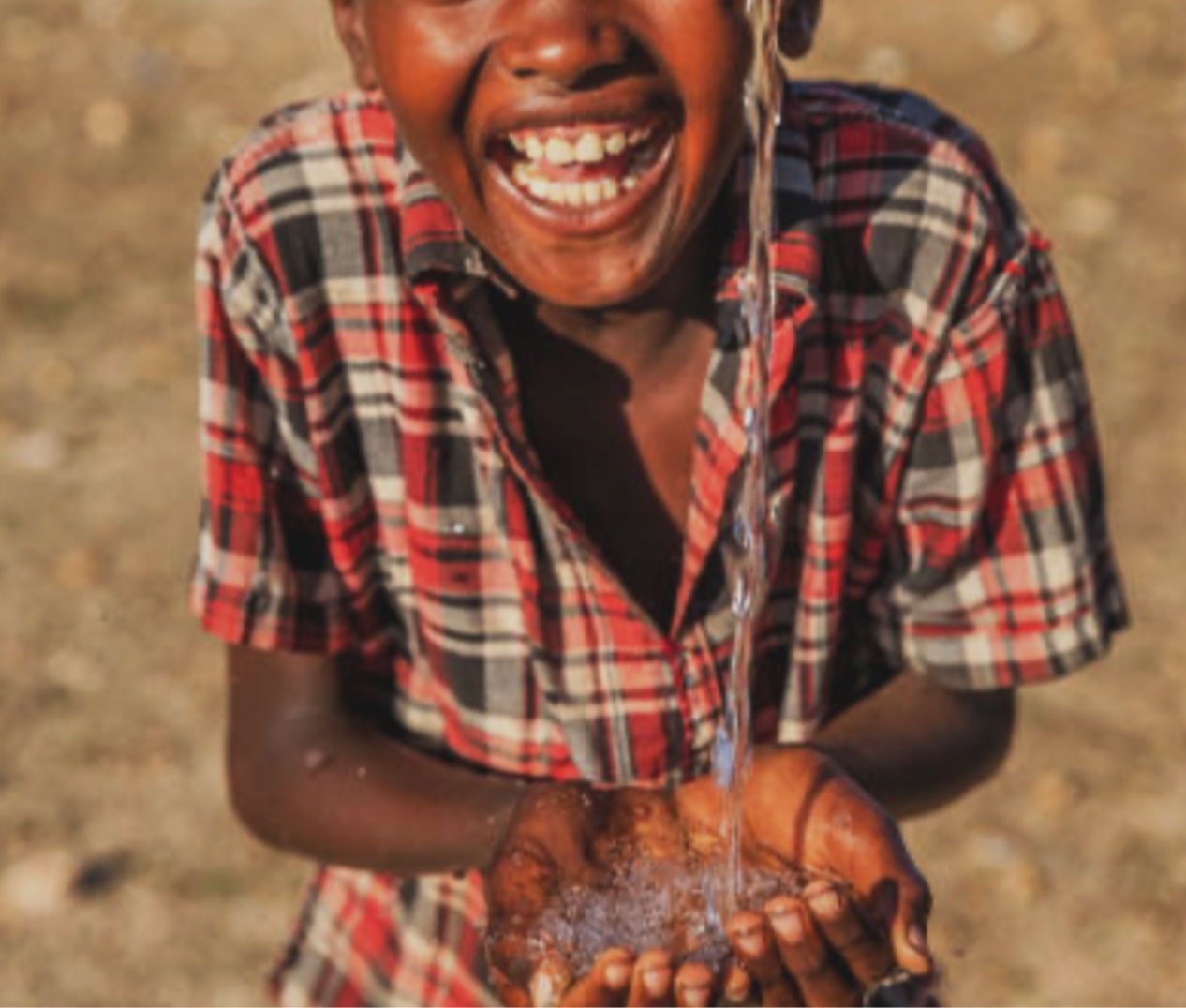 happy child receiving water